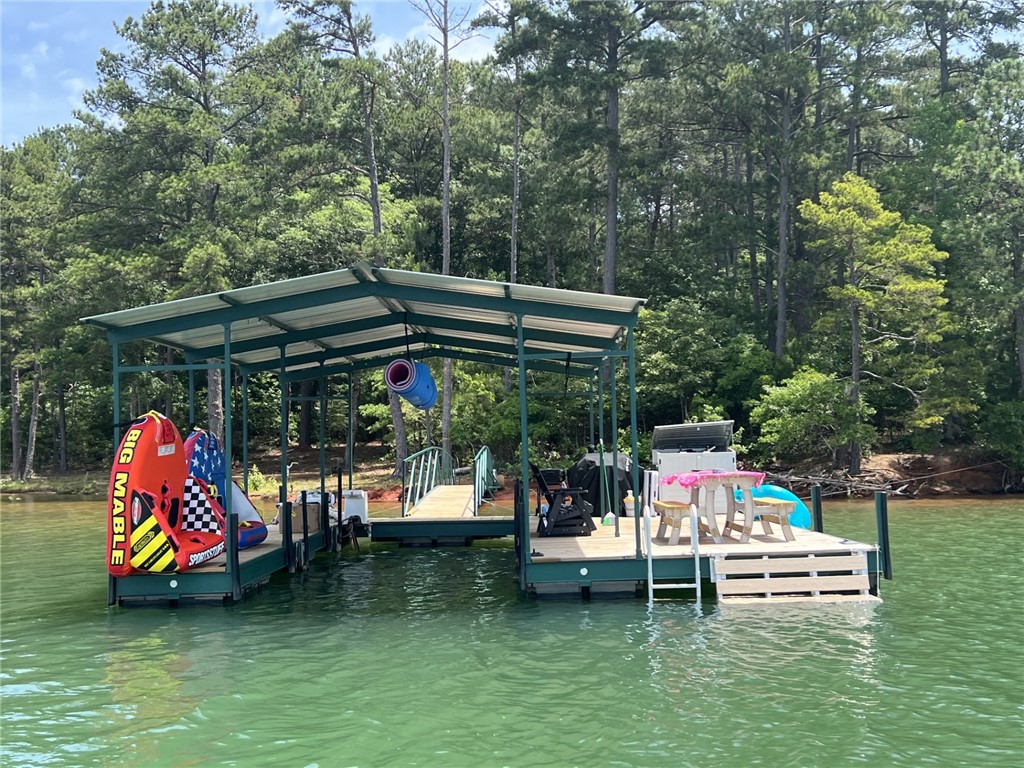 474 Overlook Drive Fair Play, SC 29643 - Photo 5 of 10 A private boat dock with ample space for water activities and relaxation on the water's edge.