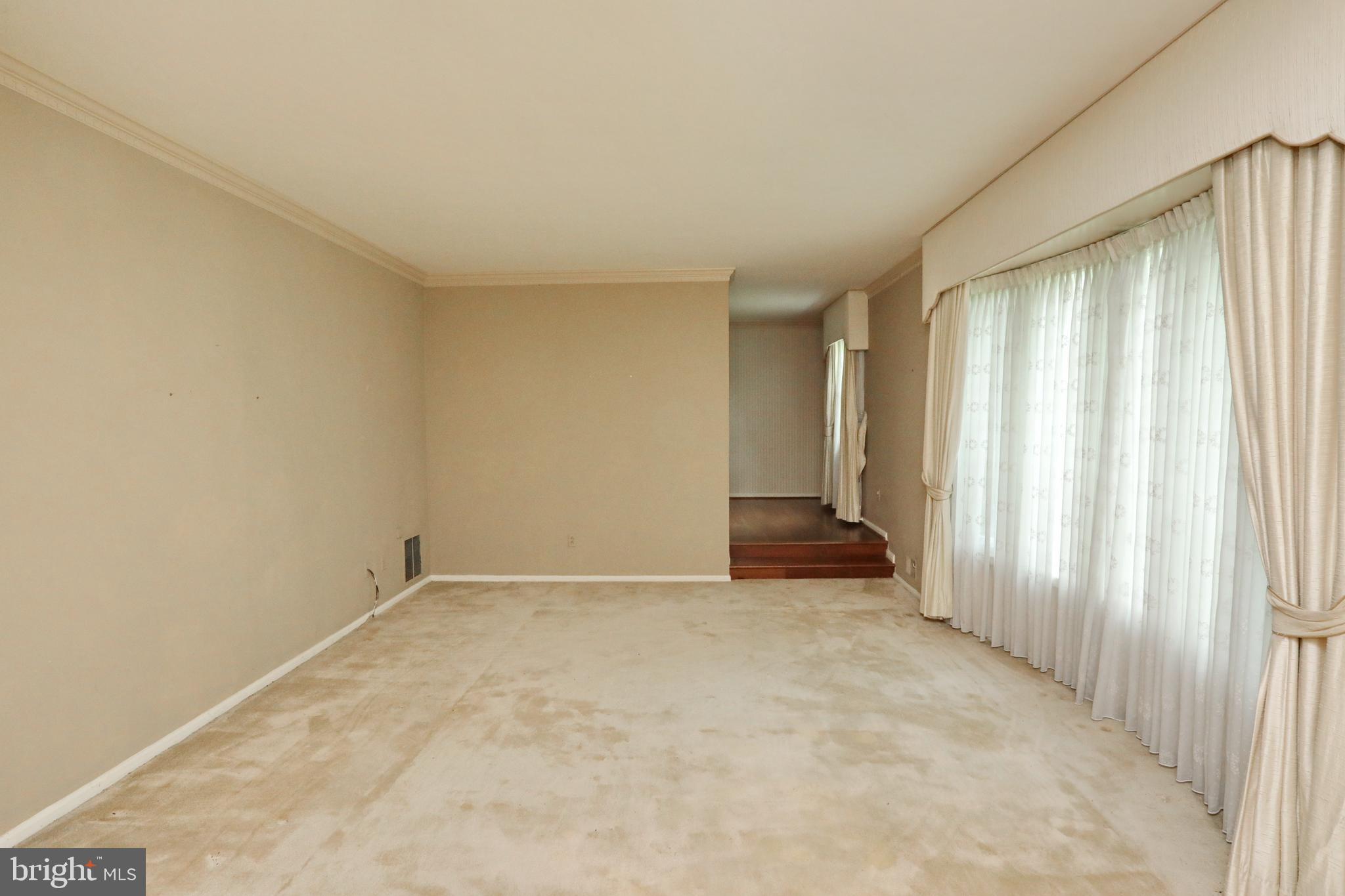 9154 Preference Drive La Plata, MD 20646 - Photo 11 of 65 Formal living room with steps to dining room