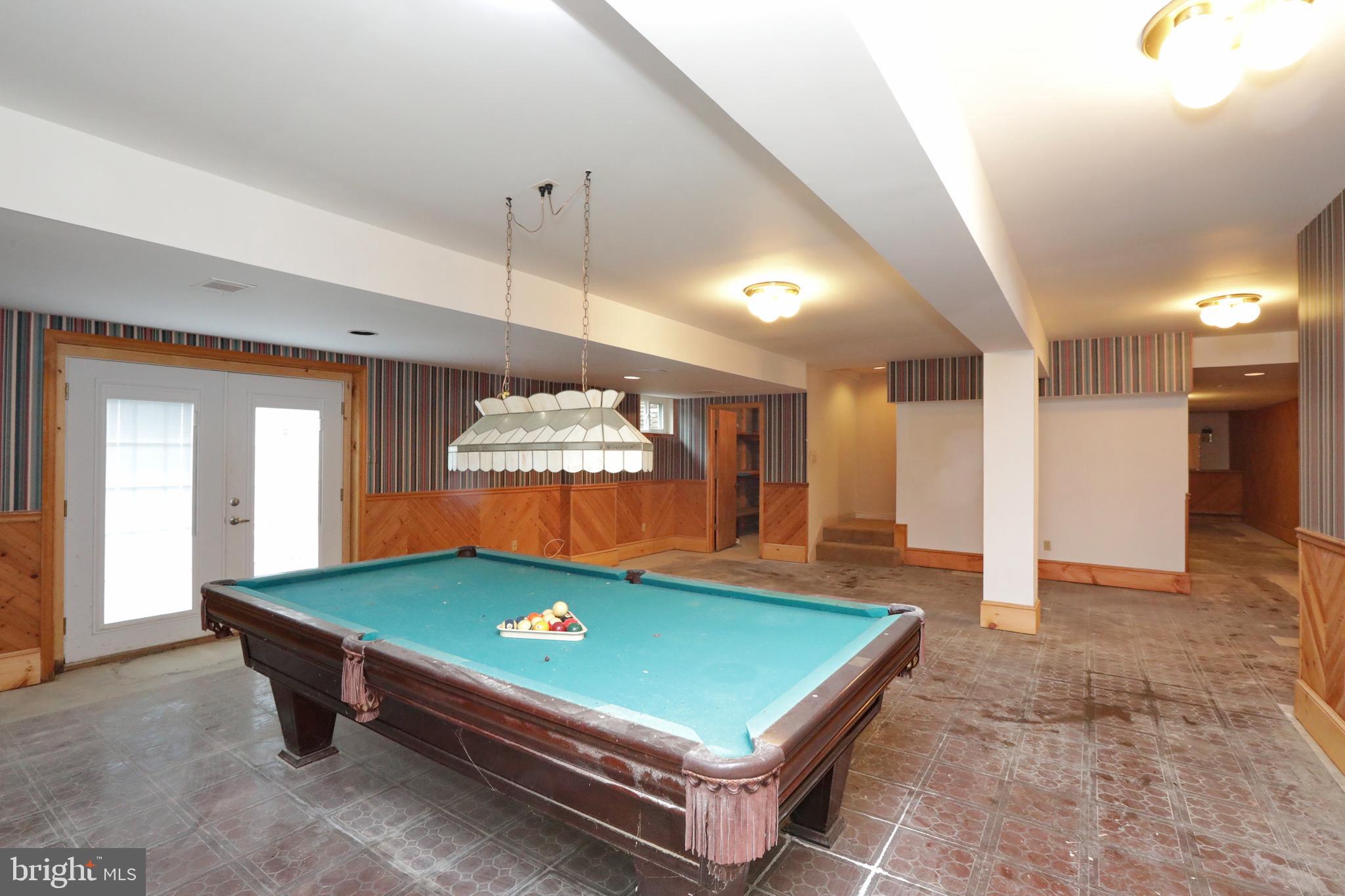 9154 Preference Drive La Plata, MD 20646 - Photo 46 of 65 Pool table in basement with outside entrance