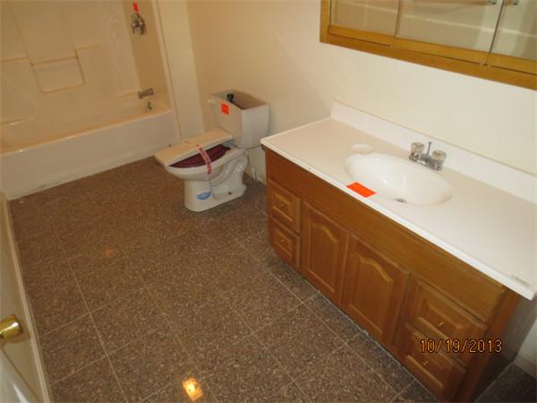 35 Houghton Street Worcester, MA 01604 - Photo 14 of 22 a bathroom with a sink and a mirror