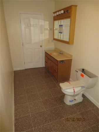 35 Houghton Street Worcester, MA 01604 - Photo 16 of 22 a bathroom with a toilet a sink and mirror