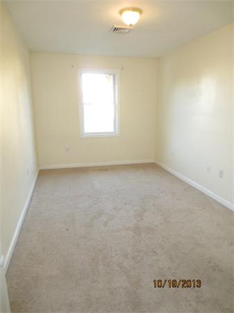 35 Houghton Street Worcester, MA 01604 - Photo 17 of 22 an empty room with a window