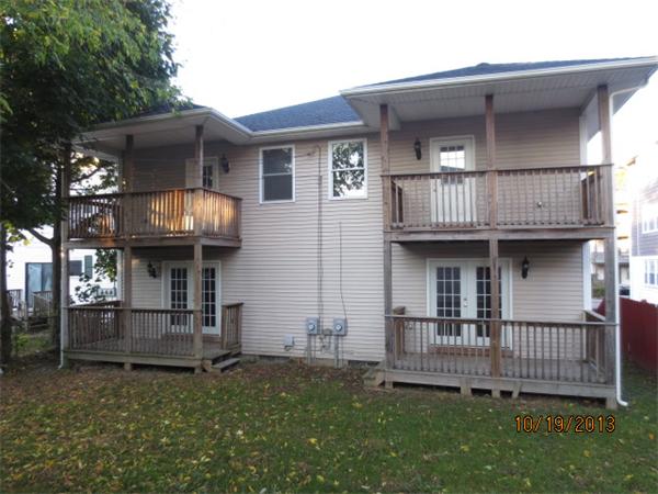 35 Houghton Street Worcester, MA 01604 - Photo 2 of 22 a front view of a house with yard and porch