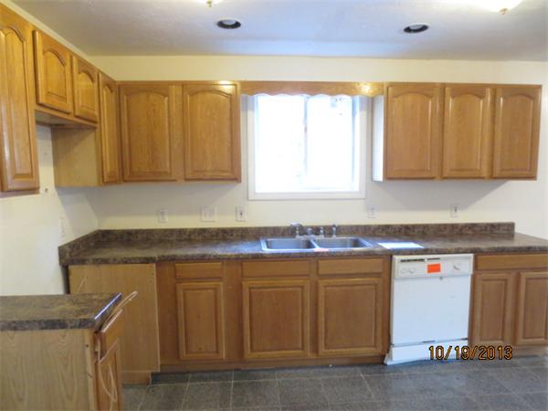 35 Houghton Street Worcester, MA 01604 - Photo 3 of 22 a kitchen with a sink a cabinets and window