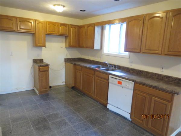 35 Houghton Street Worcester, MA 01604 - Photo 4 of 22 a kitchen with stainless steel appliances granite countertop a sink stove and cabinets