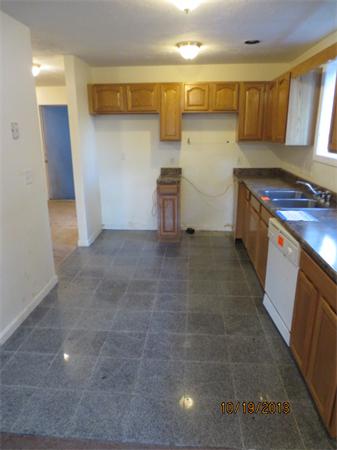 35 Houghton Street Worcester, MA 01604 - Photo 6 of 22 a kitchen with a sink and a stove top oven
