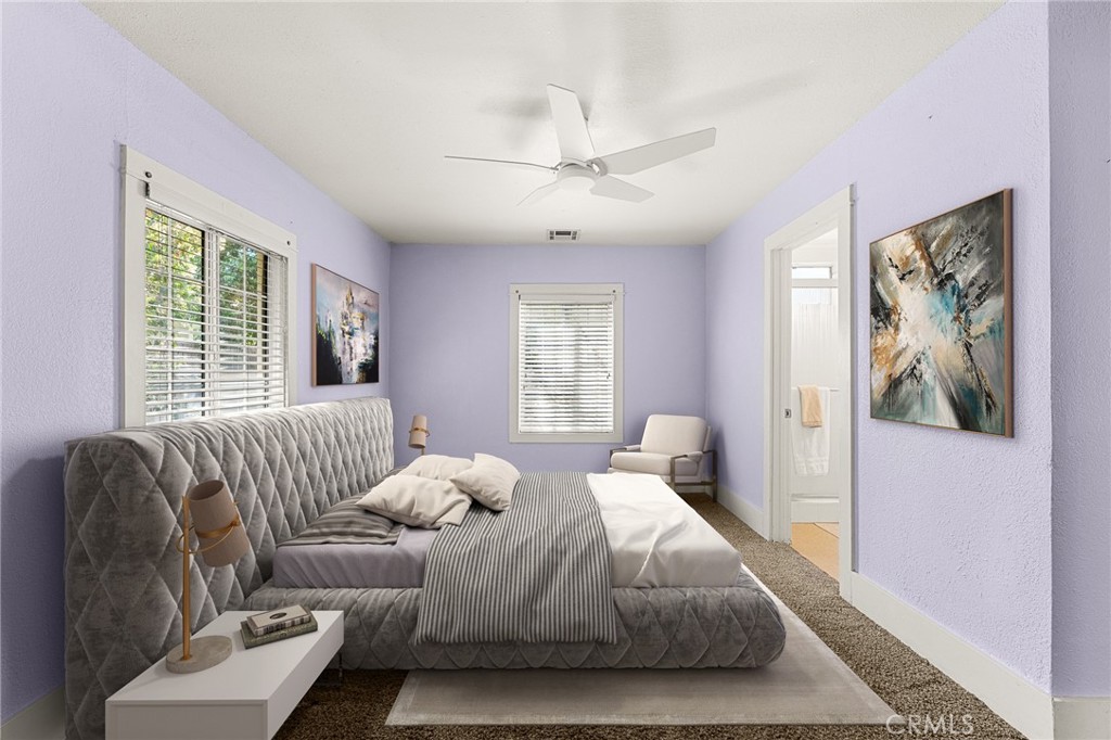 4390 Edgewood Place Riverside, CA 92506 - Photo 17 of 32 a bedroom with a bed and couch