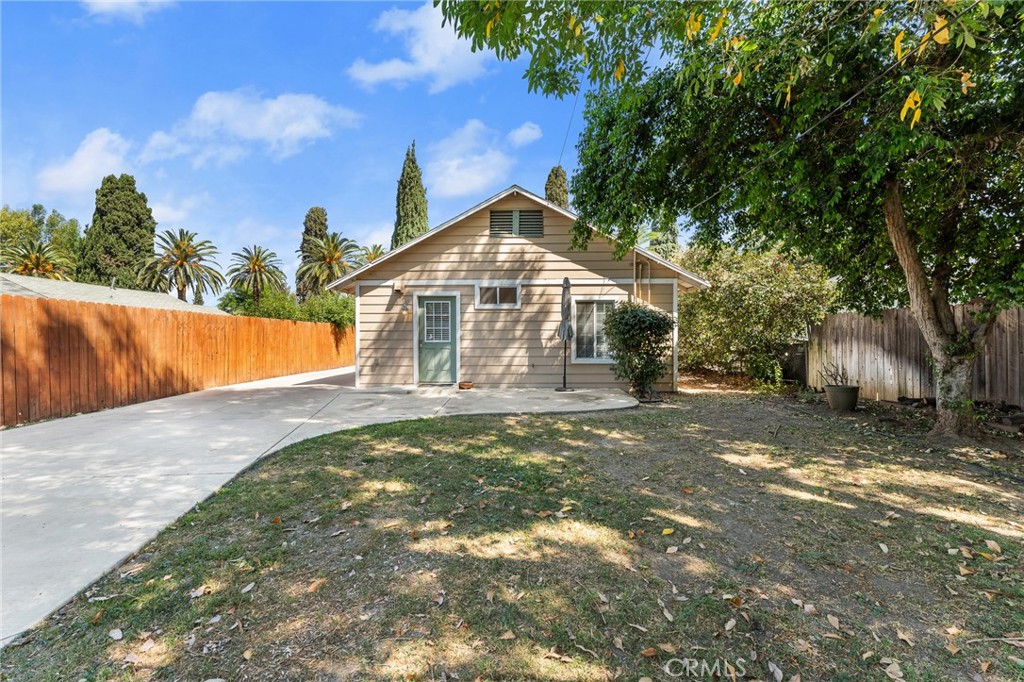 4390 Edgewood Place Riverside, CA 92506 - Photo 19 of 32 a view of a house with a yard