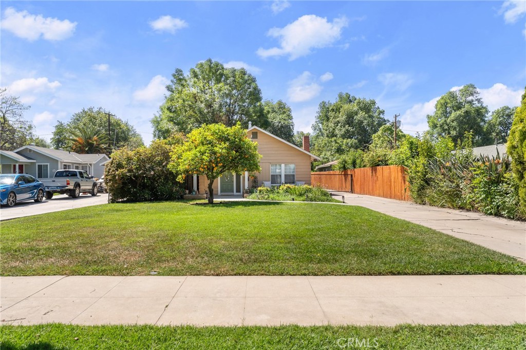 4390 Edgewood Place Riverside, CA 92506 - Photo 2 of 32 a view of a yard with a house in the background