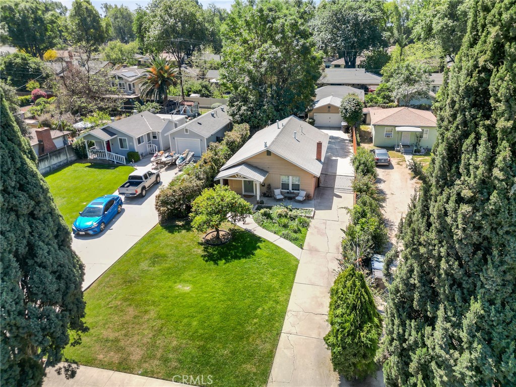 4390 Edgewood Place Riverside, CA 92506 - Photo 26 of 32 an aerial view of a house with a garden and lake view