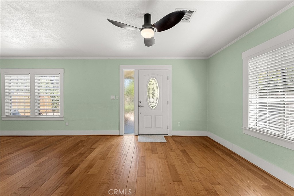 4390 Edgewood Place Riverside, CA 92506 - Photo 4 of 32 wooden floor in an empty room with a window