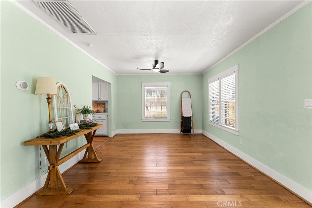 4390 Edgewood Place Riverside, CA 92506 - Photo 6 of 32 a view of a livingroom with wooden floor and a window