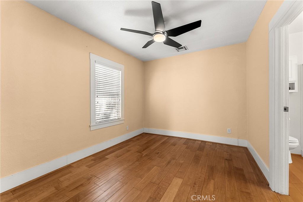 4390 Edgewood Place Riverside, CA 92506 - Photo 8 of 32 a view of a room with wooden floor and a window