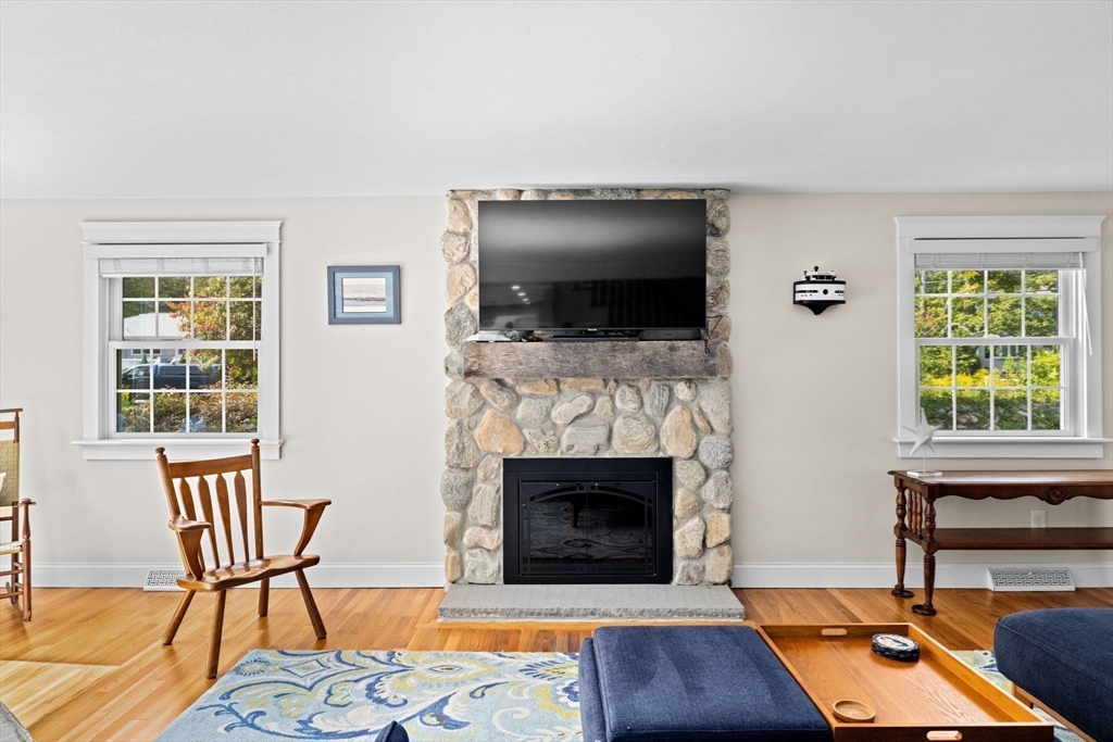 355 Tilden Road Scituate, MA 02066 - Photo 17 of 42 a living room with furniture and a fireplace