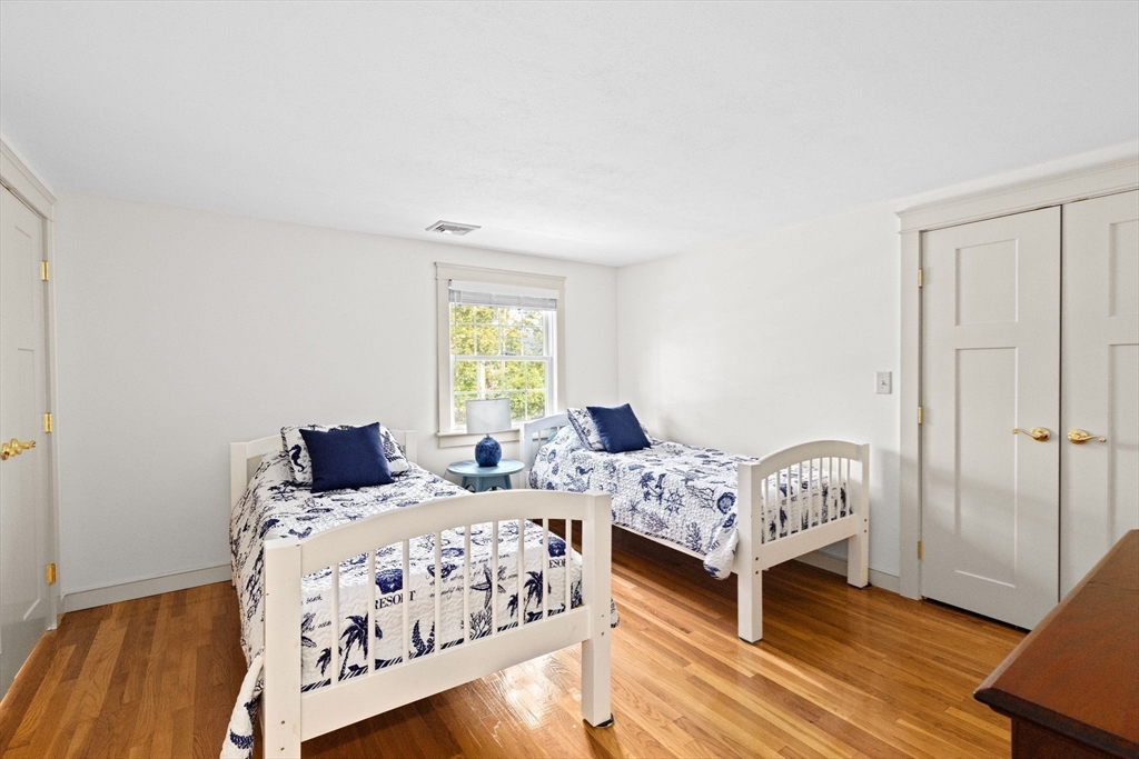 355 Tilden Road Scituate, MA 02066 - Photo 25 of 42 a bedroom with two beds and a window