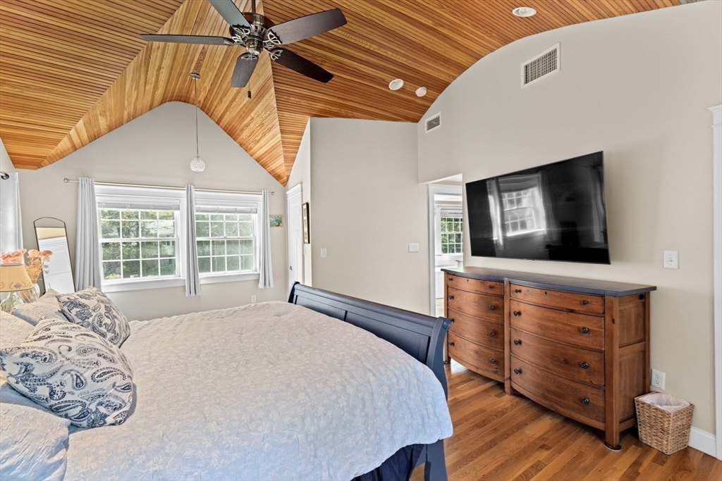 355 Tilden Road Scituate, MA 02066 - Photo 27 of 42 a bedroom with a bed and a flat screen tv