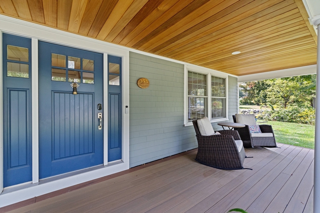 355 Tilden Road Scituate, MA 02066 - Photo 3 of 42 a view of a deck with table and chairs and wooden floor