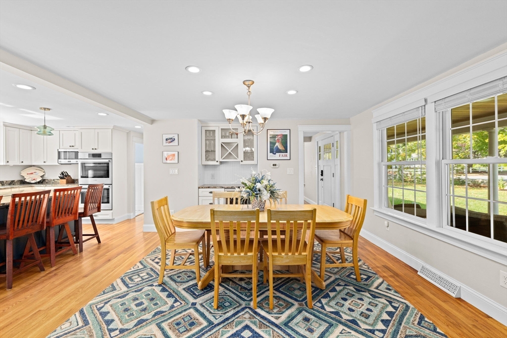 355 Tilden Road Scituate, MA 02066 - Photo 10 of 42 a view of a dining room with furniture and wooden floor