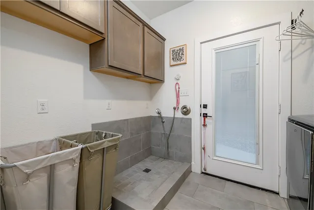 a kitchen with sink stove and cabinets