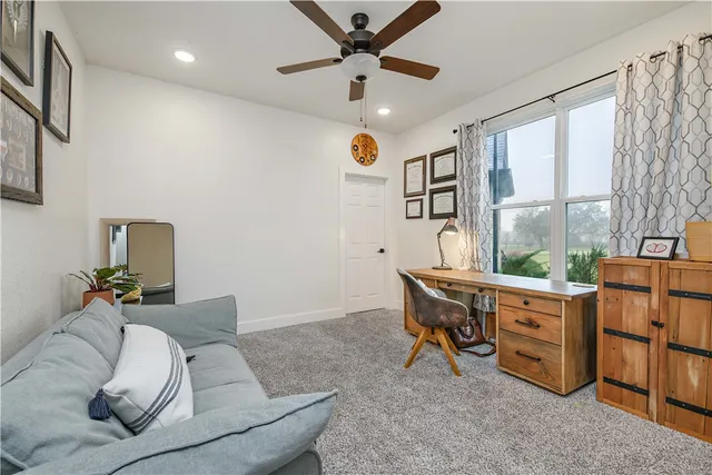 a spacious bathroom with a double vanity sink and a mirror