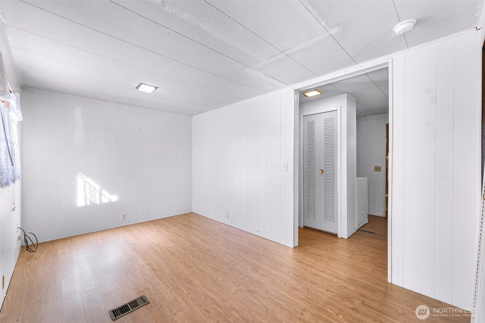 9403 Pierce Lane, Unit 1 Sedro-Woolley, WA 98284 - Photo 15 of 30 an empty room with wooden floor and windows