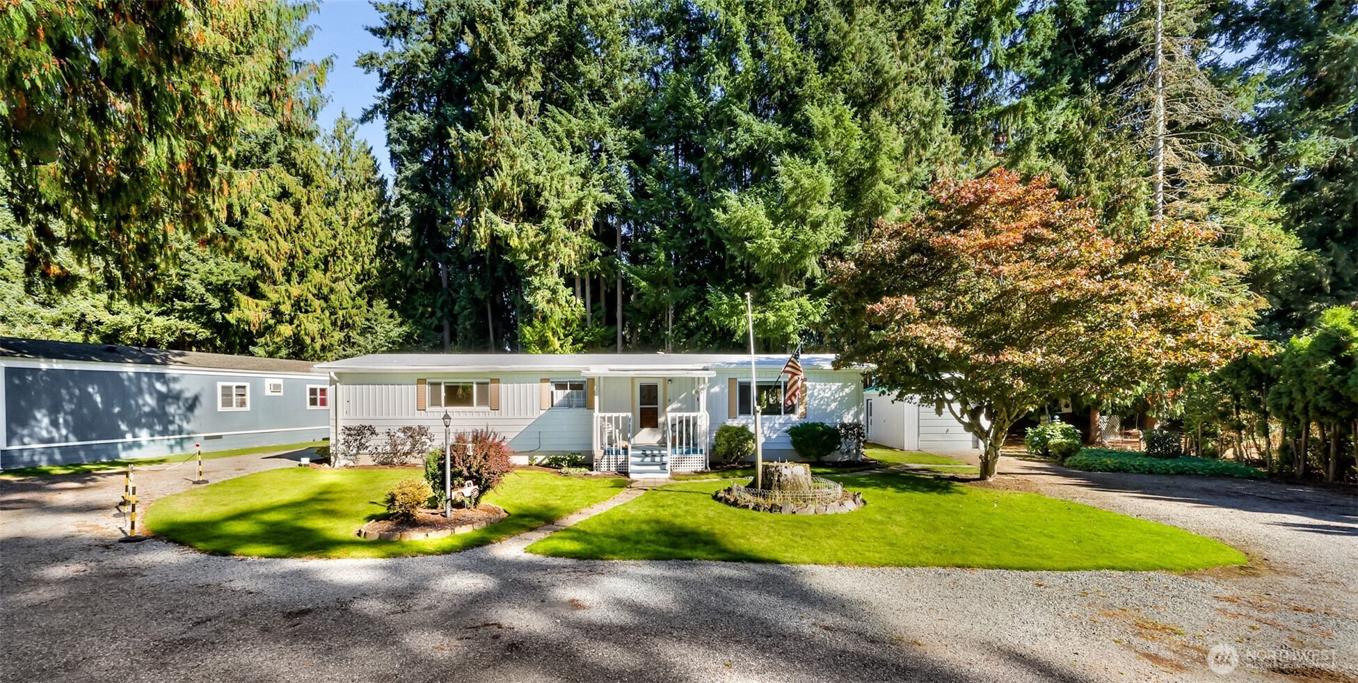 9403 Pierce Lane, Unit 1 Sedro-Woolley, WA 98284 - Photo 2 of 30 a view of a house with swimming pool and sitting area