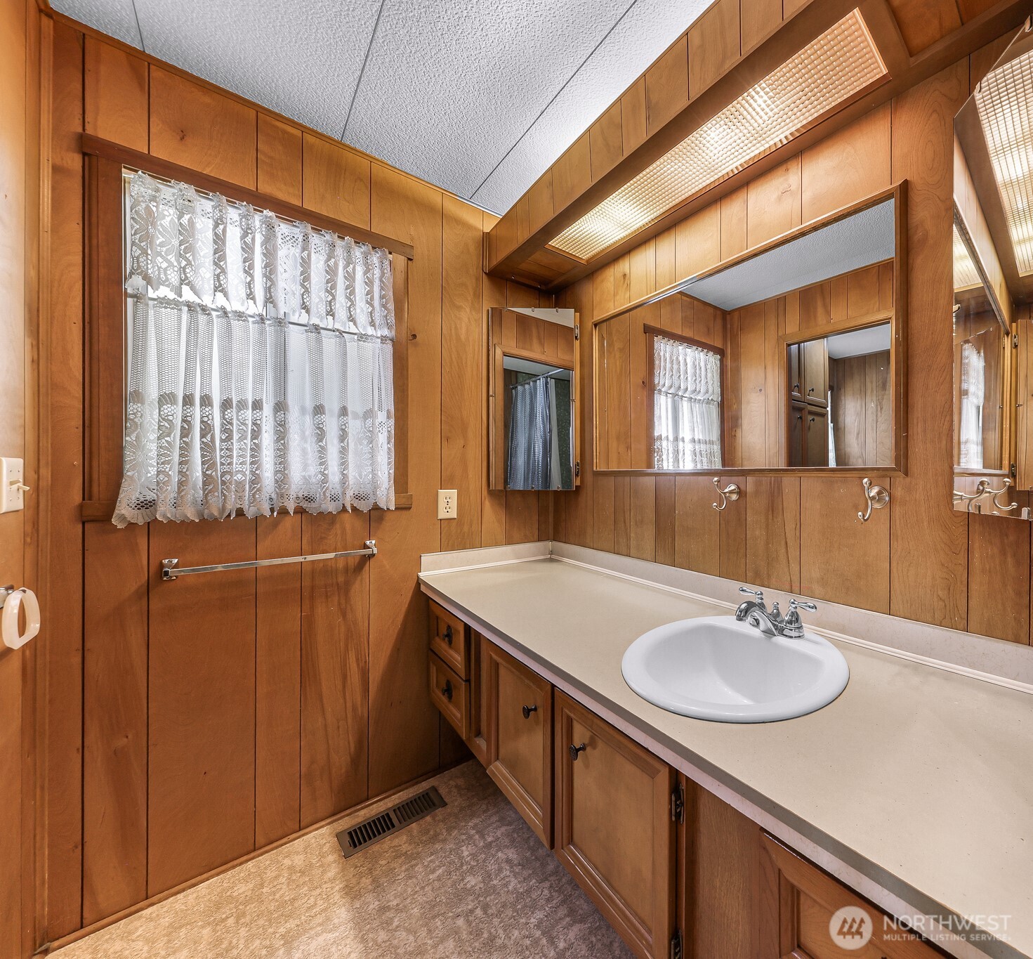 9403 Pierce Lane, Unit 1 Sedro-Woolley, WA 98284 - Photo 24 of 30 a bathroom with a sink double vanity and a mirror
