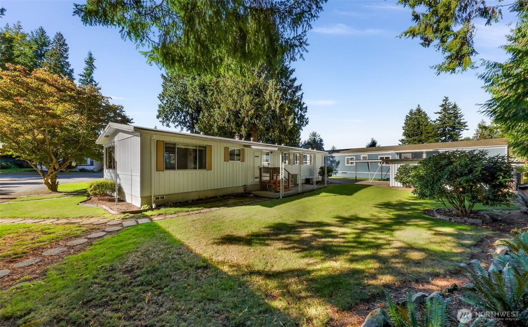 9403 Pierce Lane, Unit 1 Sedro-Woolley, WA 98284 - Photo 28 of 30 a view of a house with pool and a yard