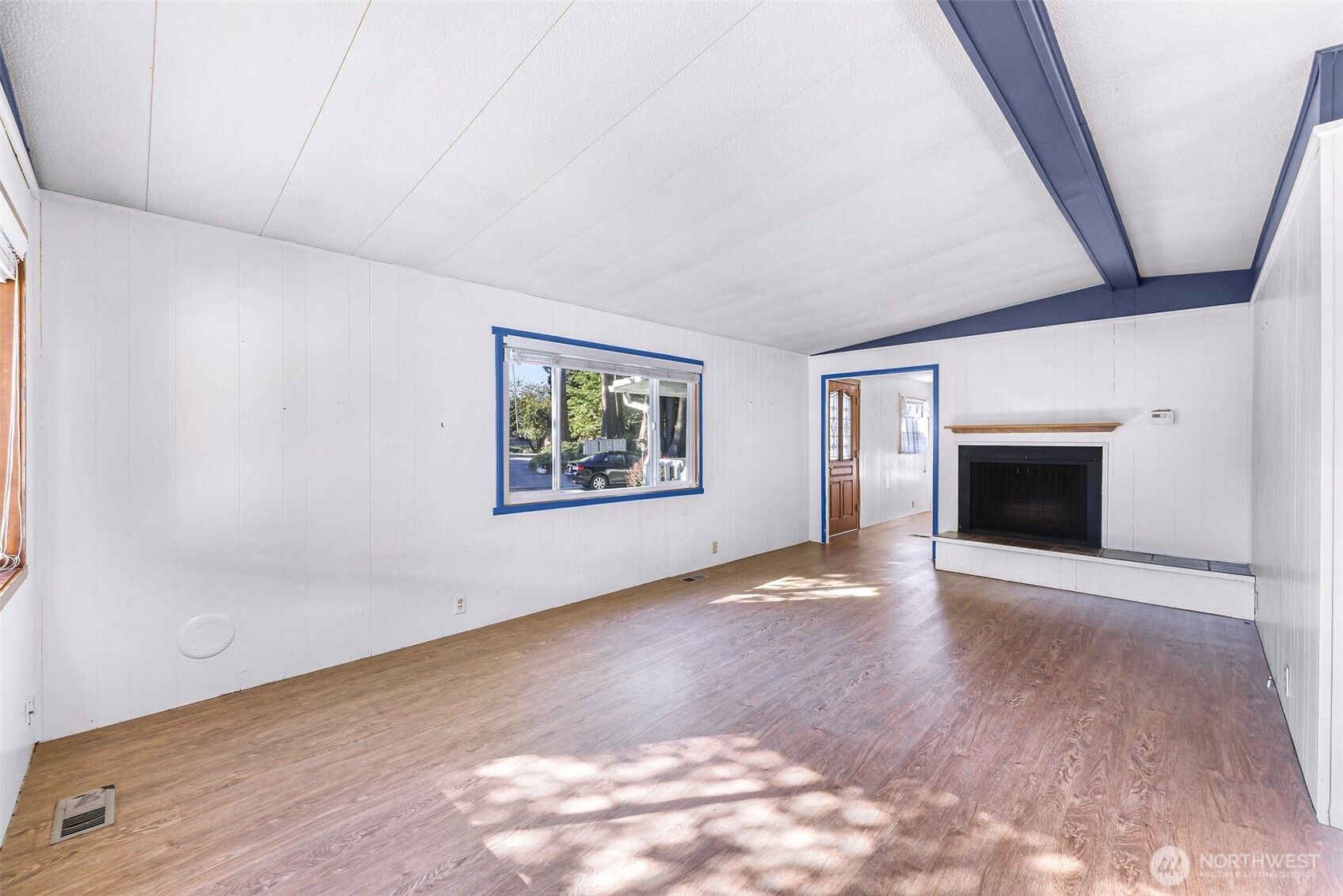 9403 Pierce Lane, Unit 1 Sedro-Woolley, WA 98284 - Photo 5 of 30 an empty room with windows and fireplace