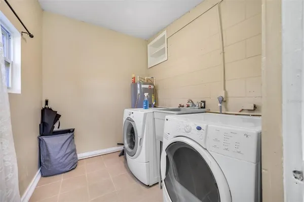a utility room with dryer and washer
