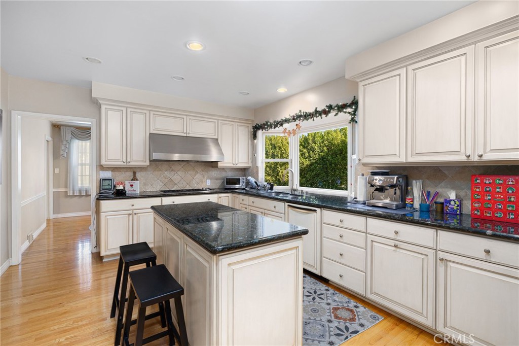 2964 Lombardy Road Pasadena, CA 91107 - Photo 21 of 69 a kitchen with granite countertop a sink stove and cabinets
