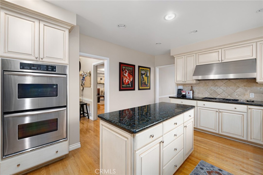 2964 Lombardy Road Pasadena, CA 91107 - Photo 22 of 69 a kitchen with granite countertop a stove sink and cabinets