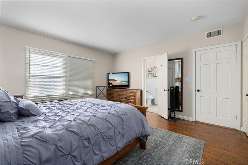 2964 Lombardy Road Pasadena, CA 91107 - Photo 26 of 69 a bedroom with a bed and wooden floor