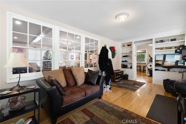 a bedroom with bed and a chandelier
