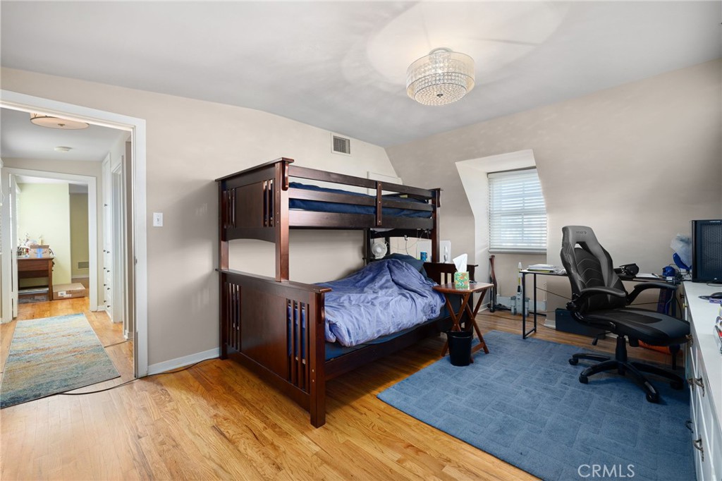 2964 Lombardy Road Pasadena, CA 91107 - Photo 38 of 69 a bedroom with bed and a chandelier