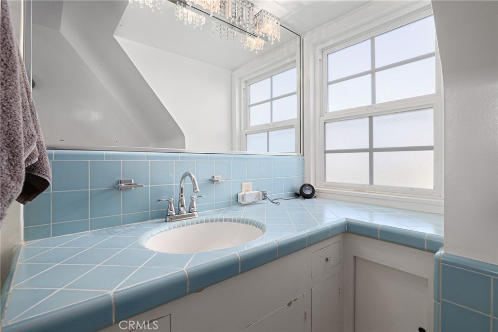 2964 Lombardy Road Pasadena, CA 91107 - Photo 43 of 69 a bathroom with a sink and a window
