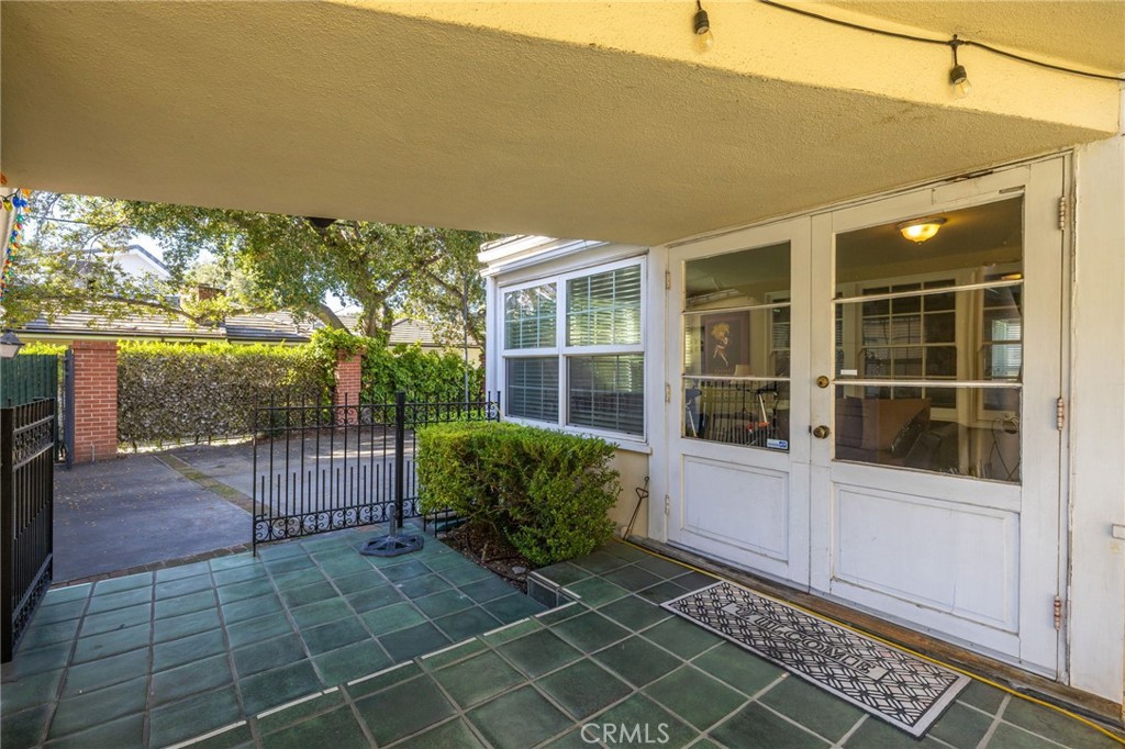 2964 Lombardy Road Pasadena, CA 91107 - Photo 57 of 69 a view of a porch with a floor to ceiling window and wooden floor