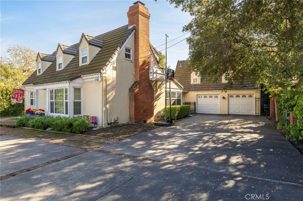 2964 Lombardy Road Pasadena, CA 91107 - Photo 6 of 69 a view of a white house with a yard and plants