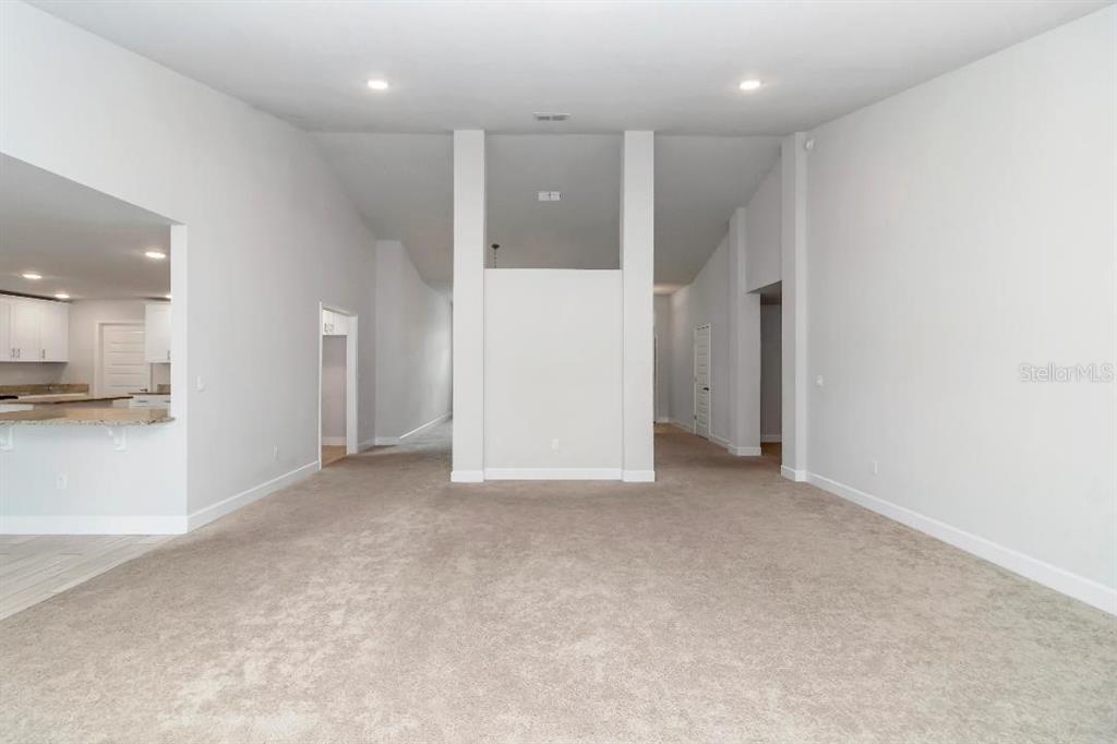 8376 Southwest 59th Terrace Ocala, FL 34476 - Photo 13 of 23 a view of an empty room and a kitchen