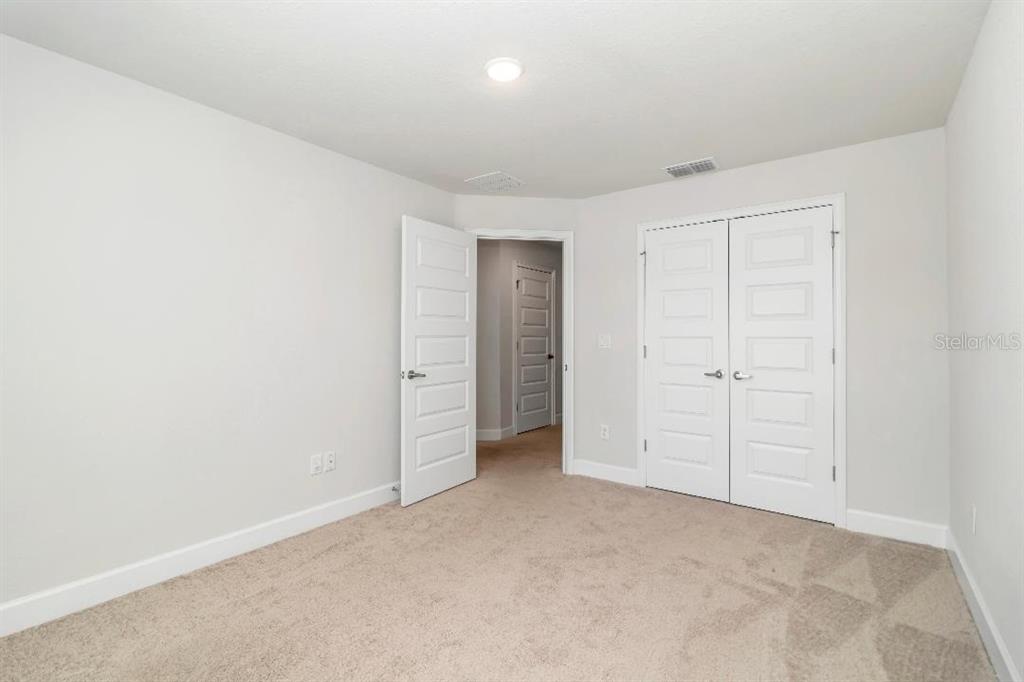 8376 Southwest 59th Terrace Ocala, FL 34476 - Photo 21 of 23 an empty room with closet area