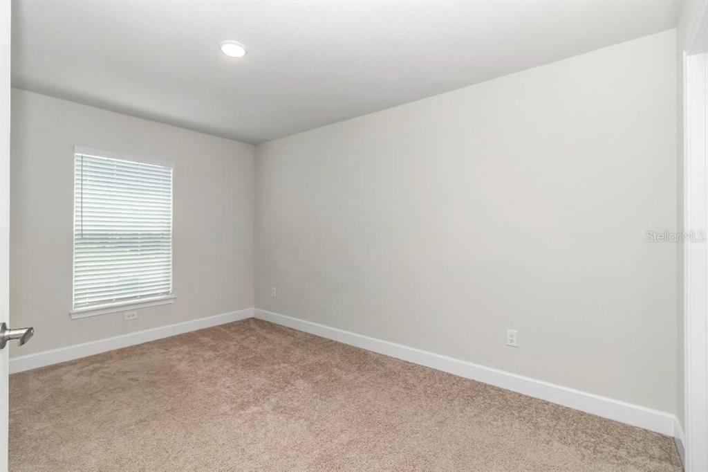 8376 Southwest 59th Terrace Ocala, FL 34476 - Photo 22 of 23 an empty room with a window