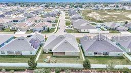 8376 Southwest 59th Terrace Ocala, FL 34476 - Photo 3 of 23 a aerial view of a house with a lake view