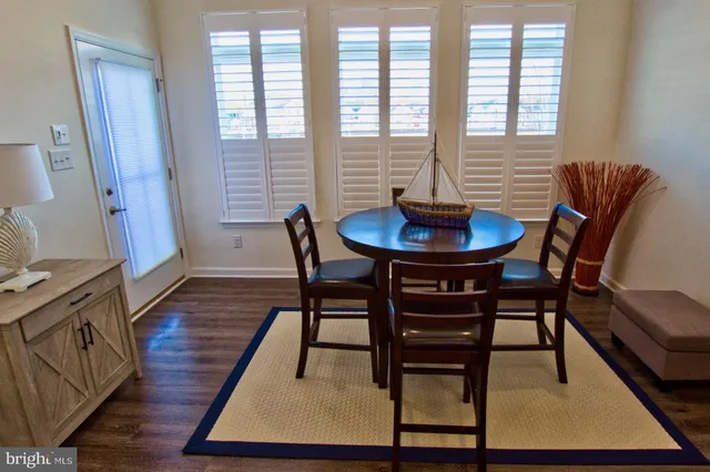 a very nice looking room with a dining table and chairs