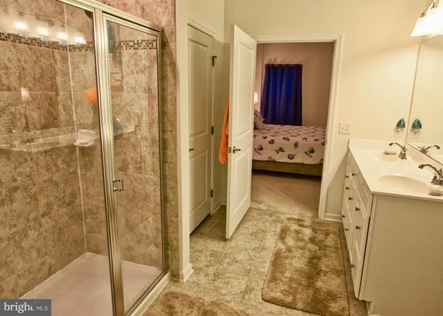 a kitchen with stainless steel appliances granite countertop a sink dishwasher a stove a microwave oven with granite countertops and cabinets