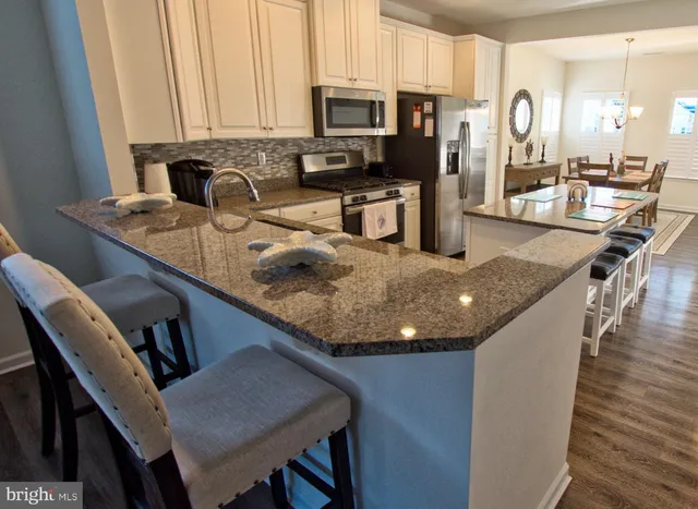 a living room with furniture and a lamp