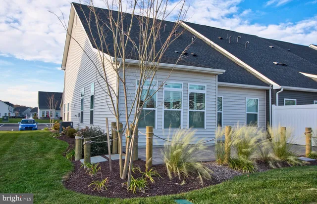 a view of a chairs and table in patio