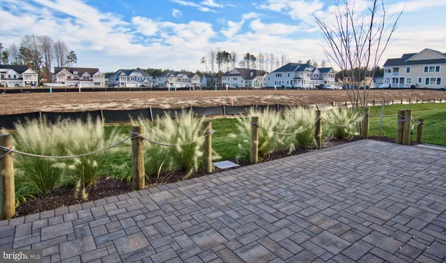 a living room with lots of furniture and a large window
