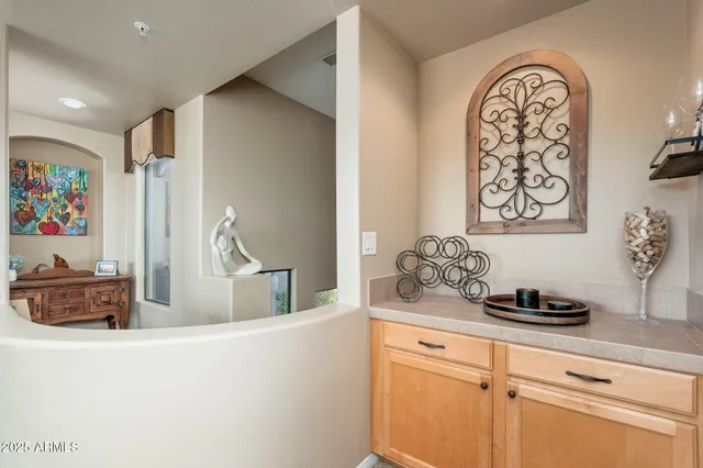 a bathroom with a tub a sink and mirror