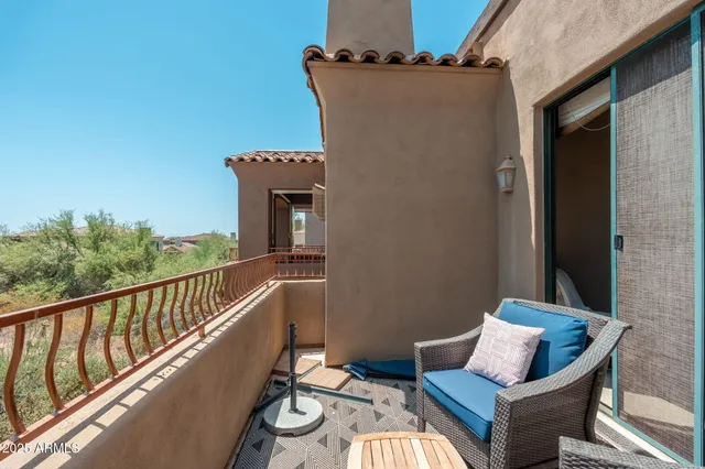 a bedroom with a bed and a lamp on table