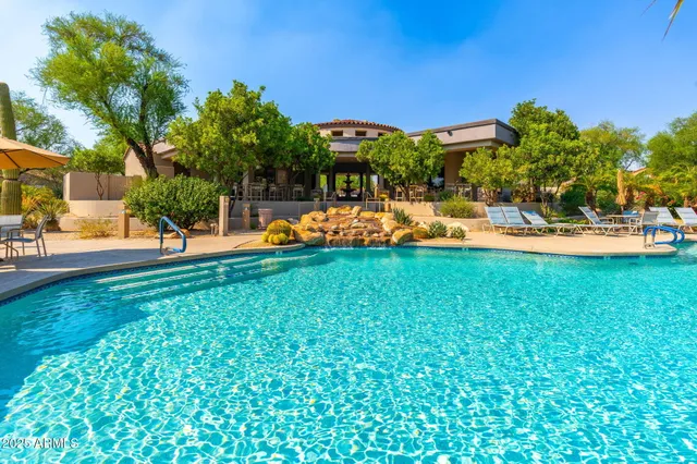 a room with gym equipment and windows